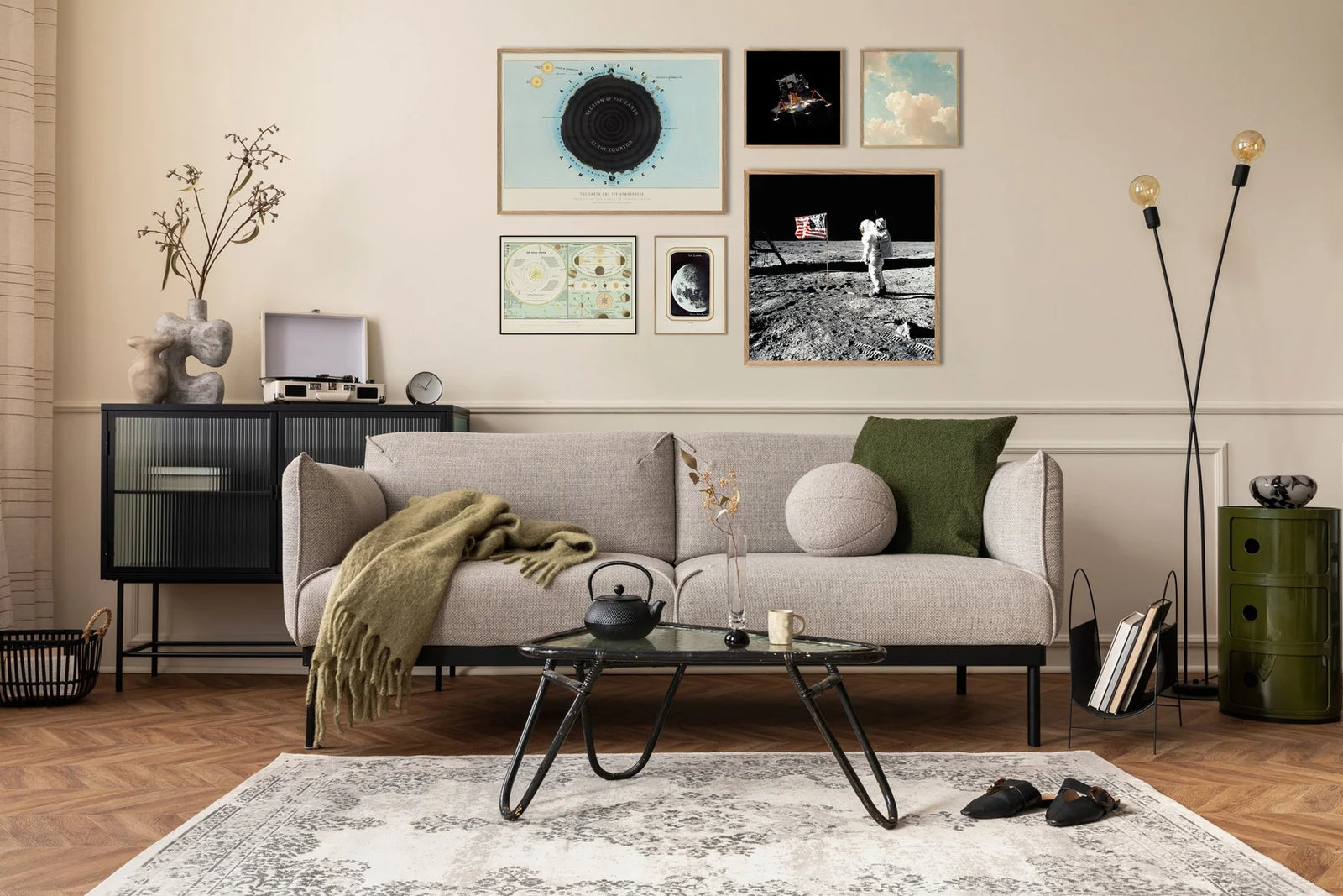 Modern living room with a gray sofa, coffee table, and decorative wall art.