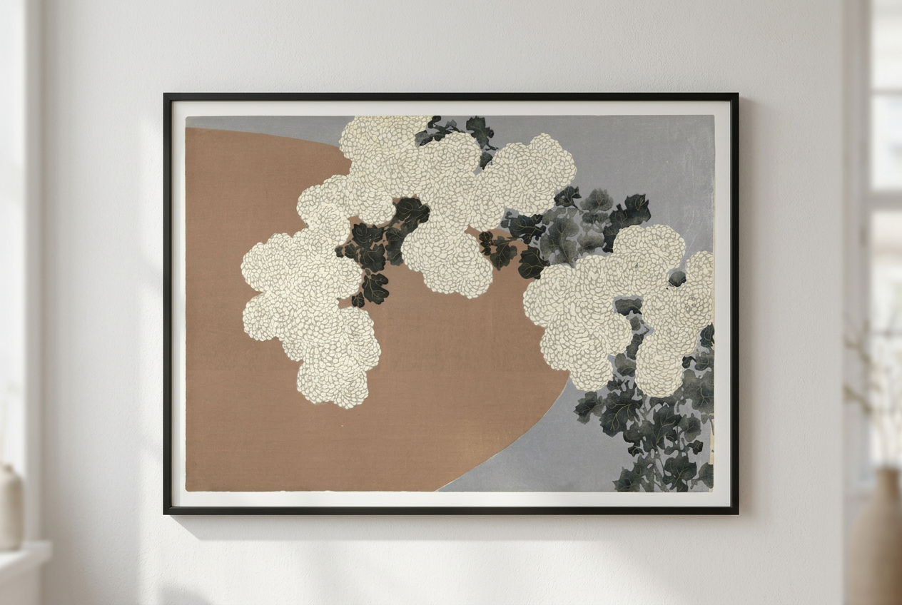 Framed abstract wall art hanging on a white wall, featuring cream textured floral shapes over a split tan and gray background with dark charcoal accents.