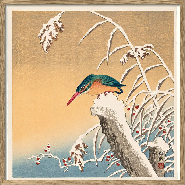 A framed Japanese-style art print depicting a colorful bird perched on a snow-covered branch, with a warm beige background and blue water at the bottom.