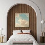 Modern bedroom with a bed, wooden headboard, and decorative wall art.