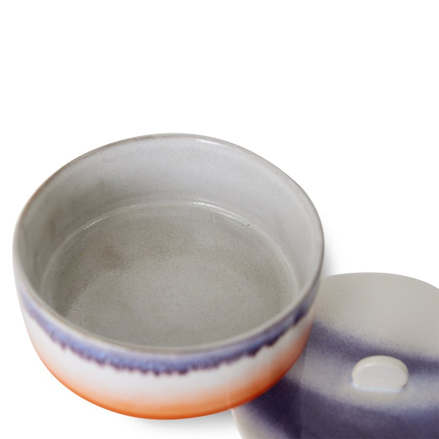 Ceramic bowl with a lid on a white background