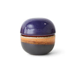 Ceramic container with a purple lid and brown base on a white background
