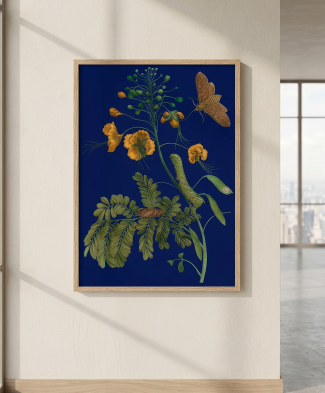 A framed botanical art print featuring yellow flowers, green leaves, and a brown butterfly on a deep blue background, displayed on a beige wall in a modern room setting.