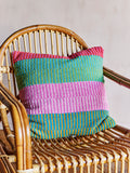 colorful stripe cushion on rattan chair
