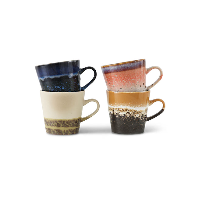 Set of three ceramic mugs with gradient colors on a white background