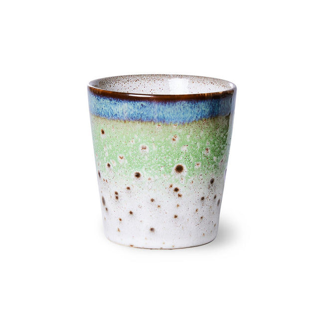 Ceramic mug with a speckled design on a white background