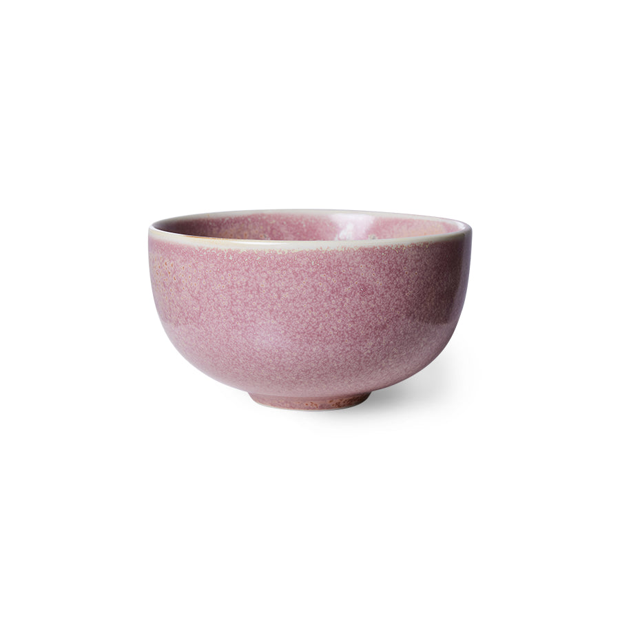Pink ceramic bowl on a white background