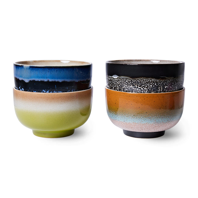 Two ceramic bowls with multicolored glazes on a white background