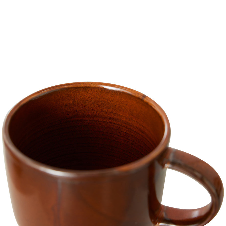 Brown ceramic mug on a white background