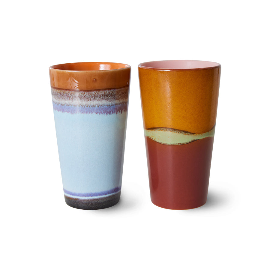 Two ceramic tumblers with multicolored glaze on a white background