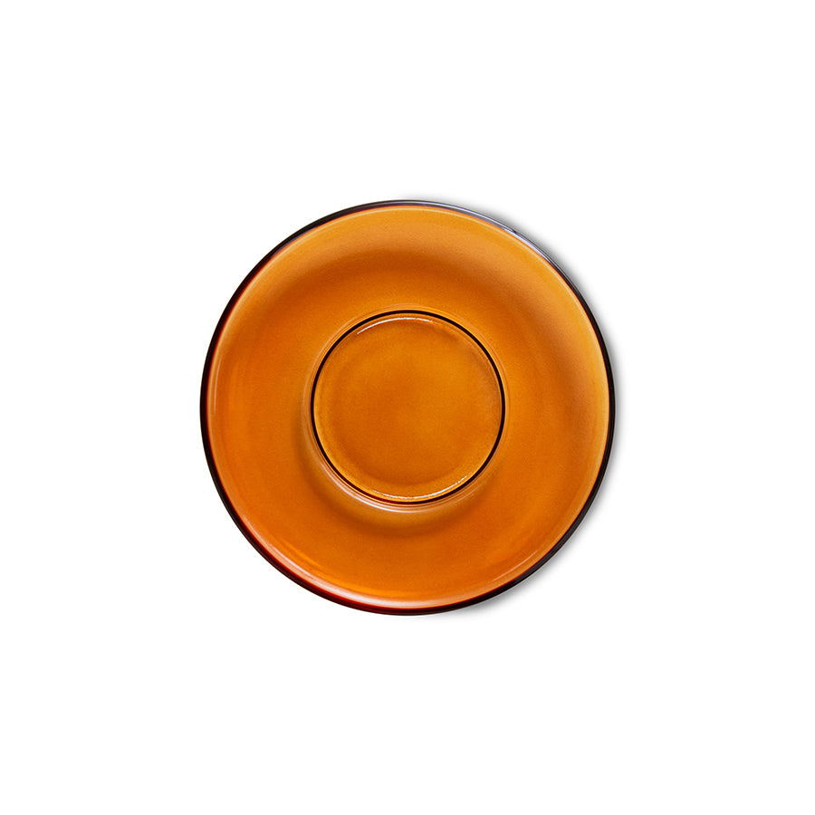 Orange plate with black rim on a white background