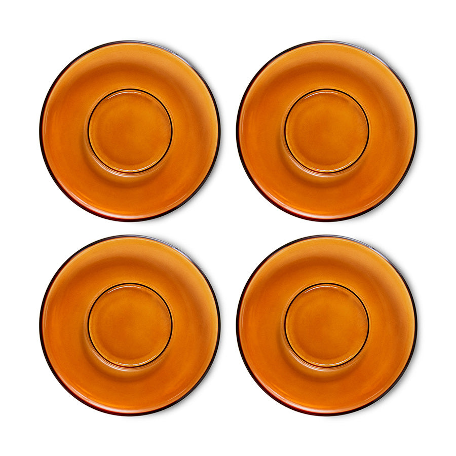 Four orange ceramic plates on a white background