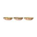 Three small decorative bowls with scalloped edges on a white background