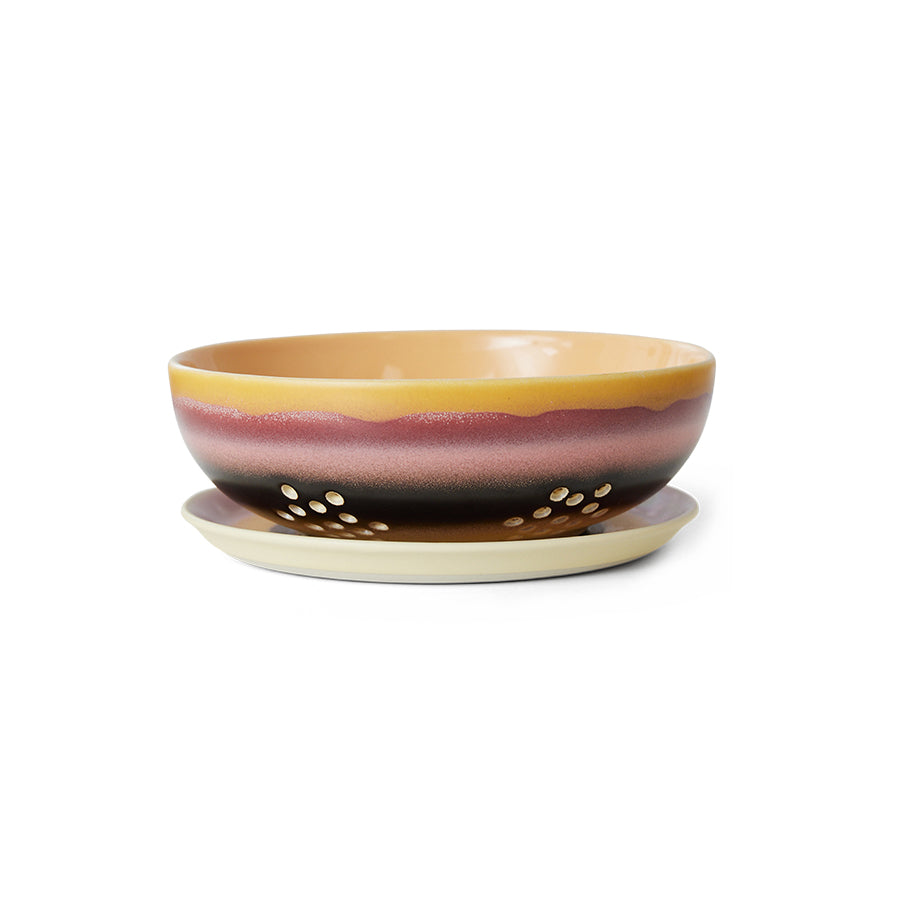 Ceramic bowl with striped design on a white background