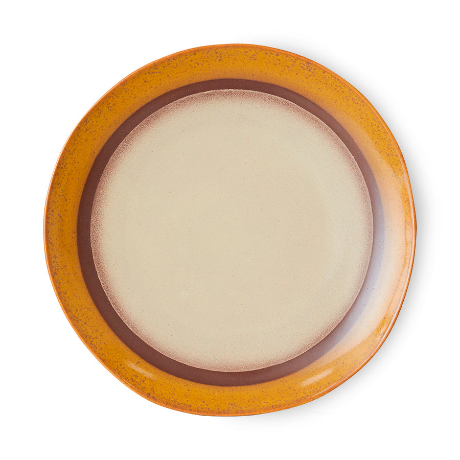 Round ceramic plate with a brown rim on a white background