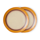 Two round ceramic plates with a brown rim on a white background