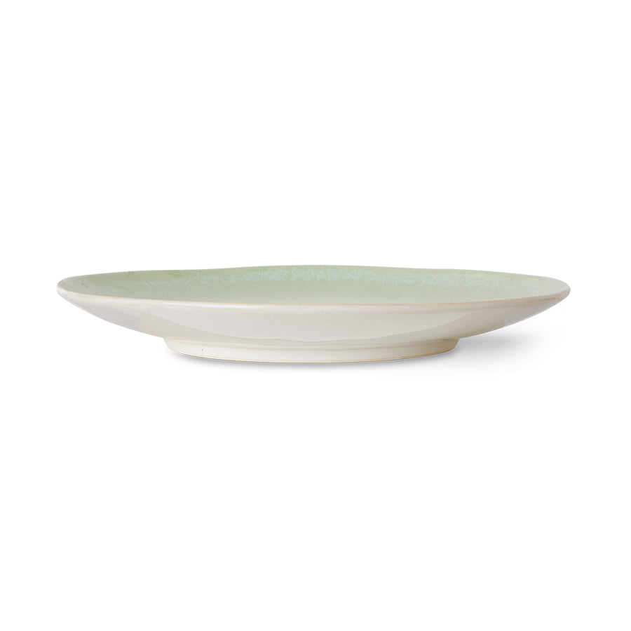 Green ceramic plate on a white background