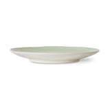 Green ceramic plate on a white background