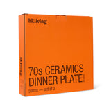 Orange box with 'hkliving' branding and text about 70s ceramics dinner plates on a white background