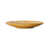 Yellow ceramic plate on a white background