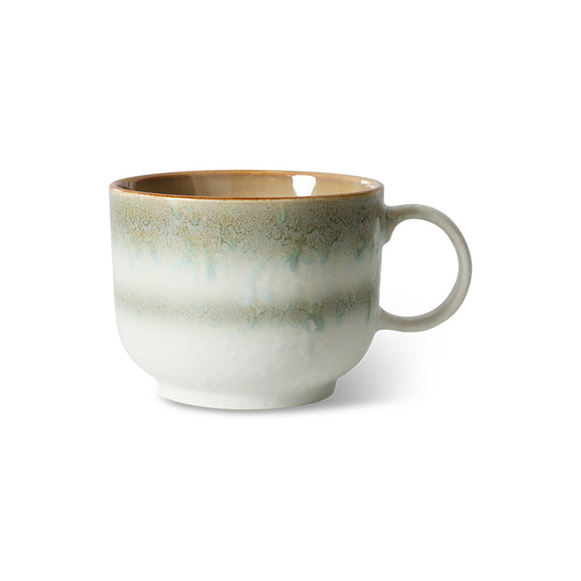 Ceramic mug with a textured design on a white background