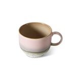 Ceramic mug with a gradient design on a white background