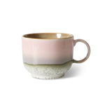 Ceramic mug with a two-tone design on a white background