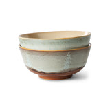 Set of two ceramic bowls with textured surfaces on a white background