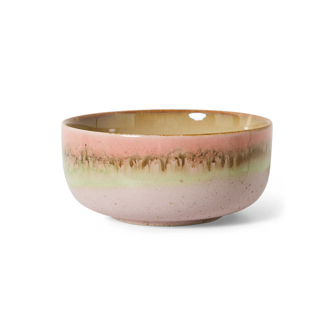 Ceramic bowl with a pink and gold gradient on a white background