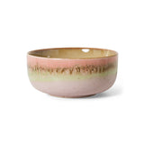 Ceramic bowl with a pink and gold gradient on a white background
