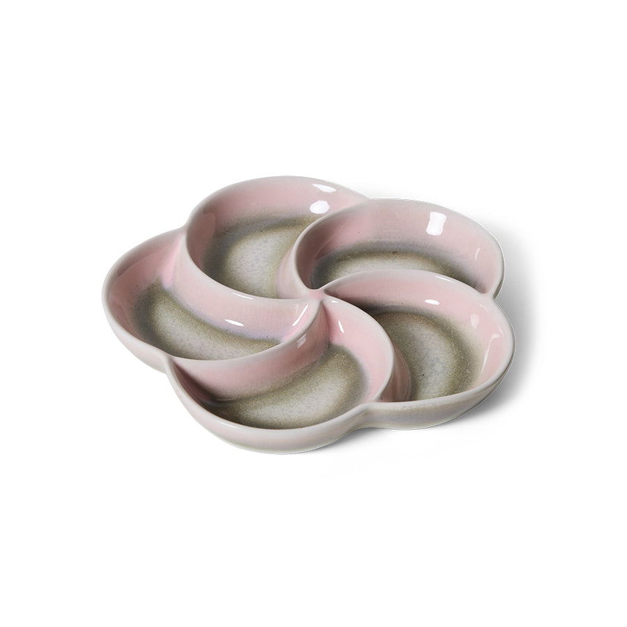 Pink ceramic dish with a unique design on a white background