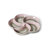 Pink ceramic dish with a unique design on a white background