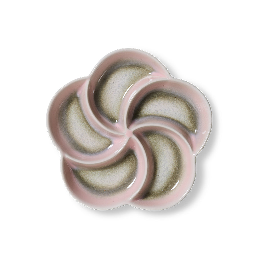 Ceramic flower-shaped dish with pink rim on a white background