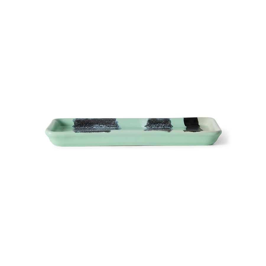 Green rectangular tray with black accents on a white background