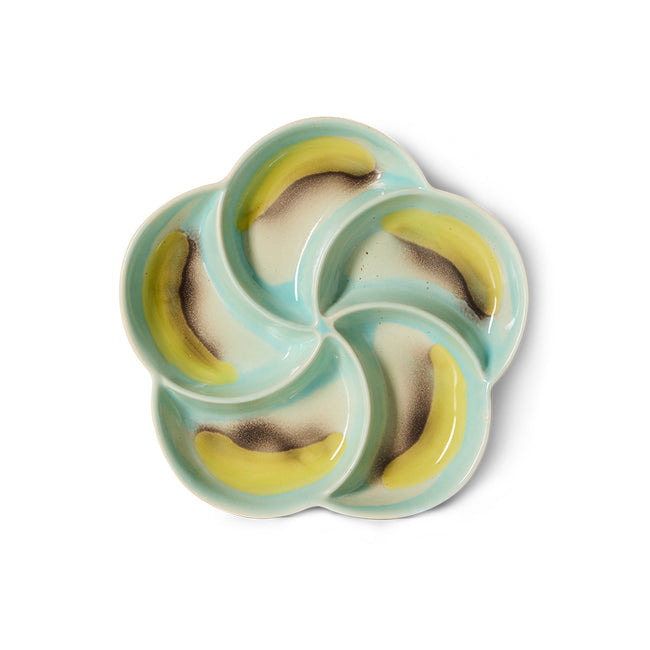 Ceramic dish with banana design on a white background