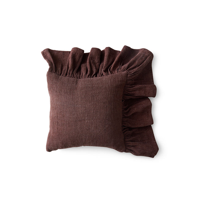 Brown pillow with ruffled edges on a white background